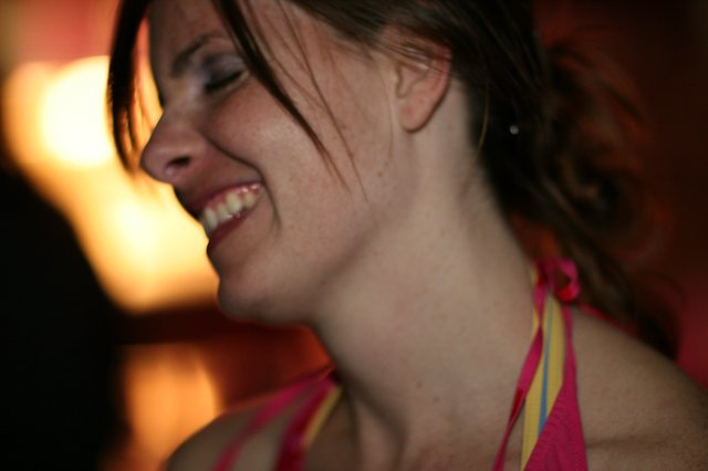 Joyful Woman Laughing in Warm Evening Light