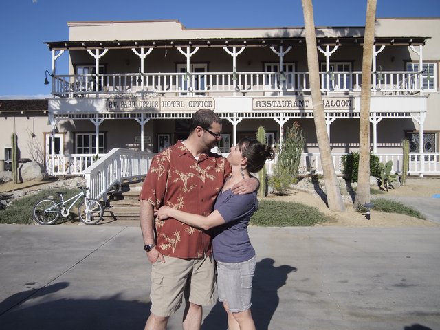 Couple's Romantic Moment at Desert Hotel Saloon