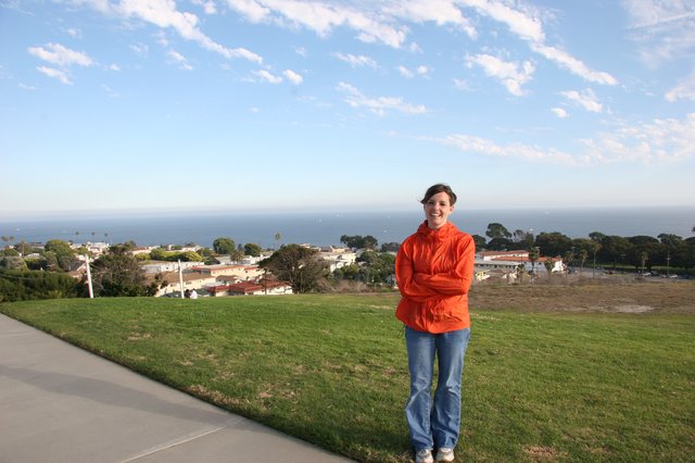 Smiling Woman Overlooking Coastal California Town