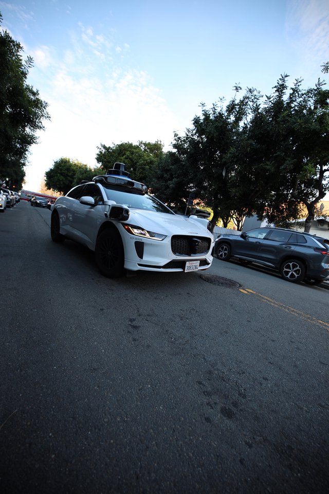 Autonomous Jaguar I-PACE Self-Driving Vehicle on Residential Street