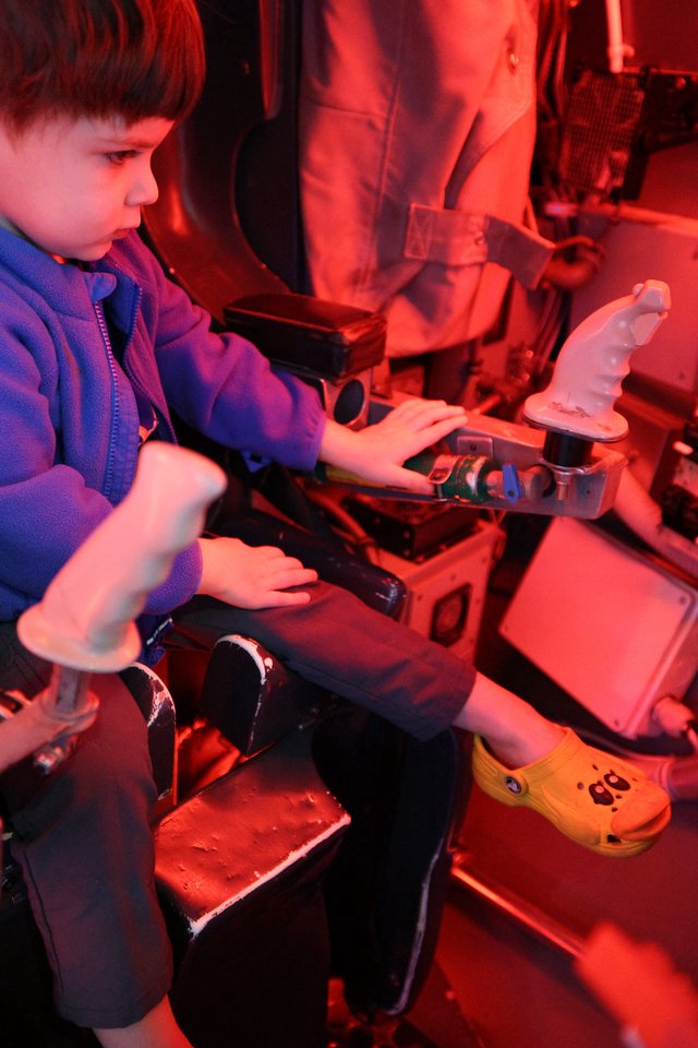 Young Scientist Exploring Microscopy at Science Center