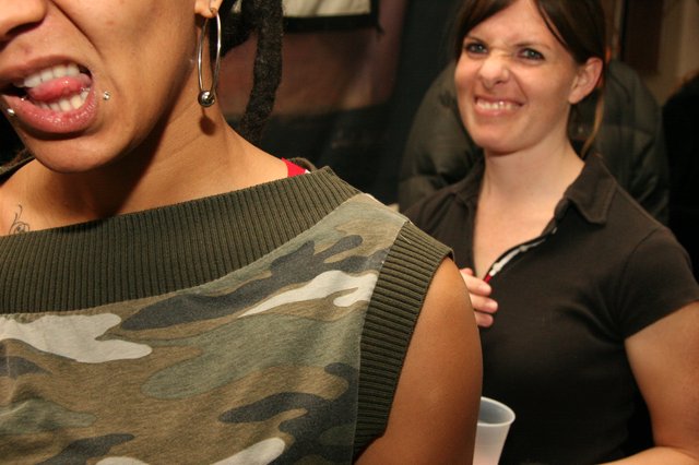 Two Women Laughing at a Casual Indoor Party