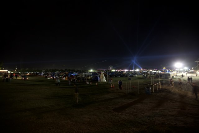 Night Sky Illuminated by Crowd and Lighting at Coachella Festival