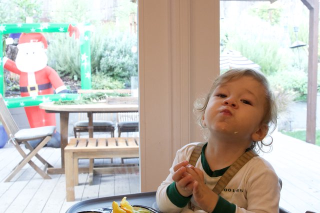 Young Child's Thoughtful Prayer Moment at Christmas