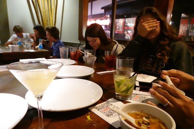 Friends Dining Together at Restaurant Table