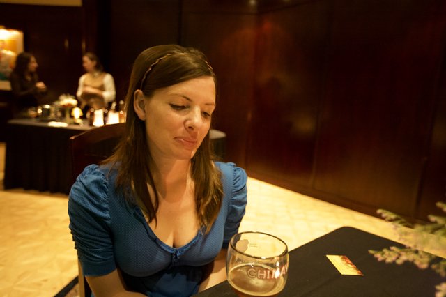 Woman Contemplating Over Chimay Beer at Bar