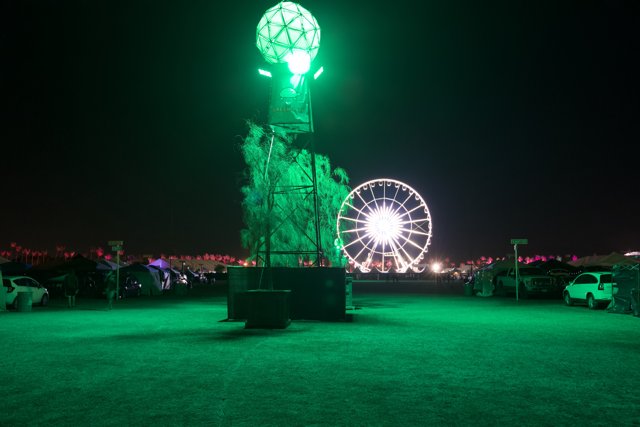 Green Light Illuminates Ferris Wheel