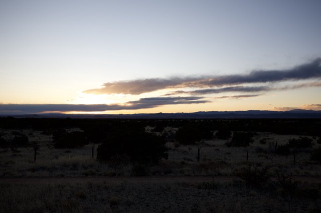 Desert Sunset Over Distant Mountains at Dusk