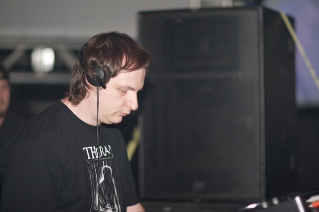 Man in T-Shirt Wearing Headphones