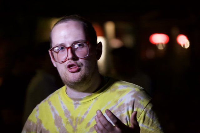 Dan Deacon in Yellow Shirt and Glasses