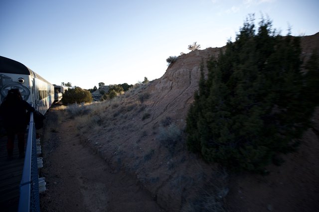 Scenic Train Journey Through Desert Canyon at Dusk