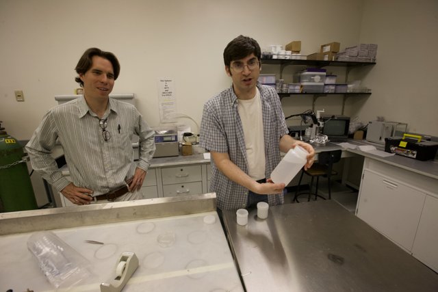 Two men conducting experiments in laboratory