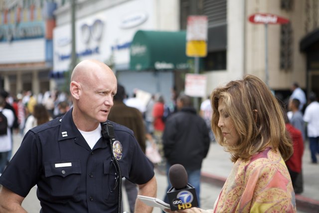 Police Officer Talks to Woman During 2007 Great American Boycott