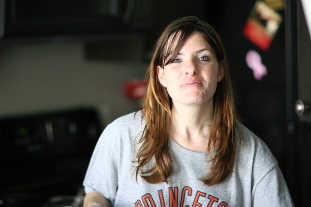 Candid Kitchen Portrait of a Thoughtful Woman