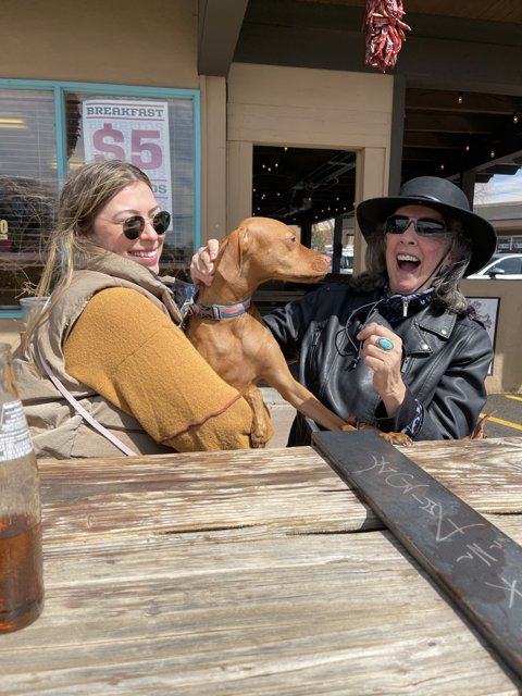 A Woman and Her Best Friend at a Santa Fe Cafe