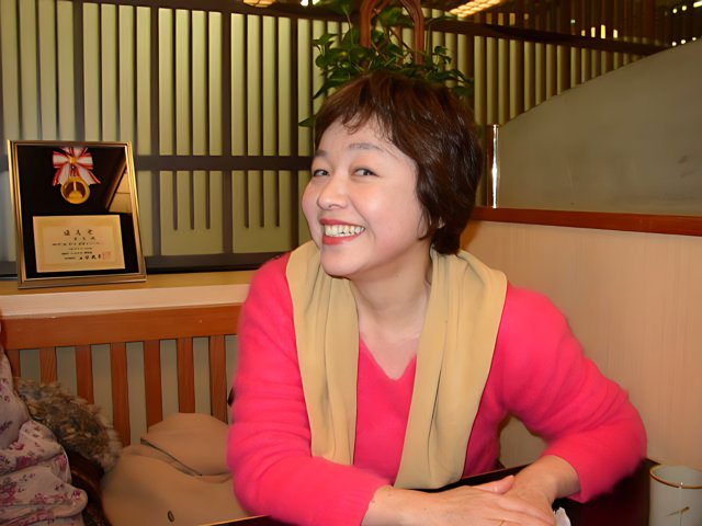 Kuniko Inoguchi: Portrait of a Smiling Woman in Kobe