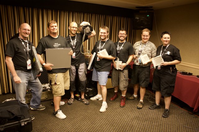 Group Shot of Defcon Attendees Holding Boxes
