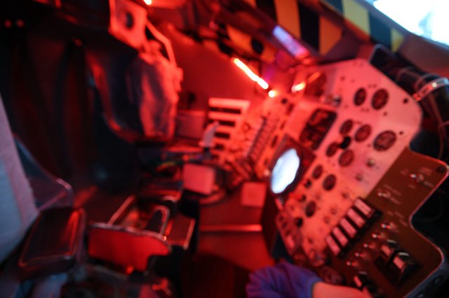 Red-Lit Space Station Interior Display at Science Center