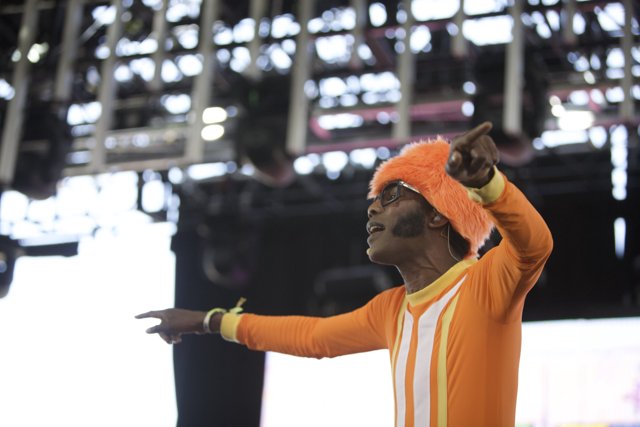 Orange Outfit Man Performs on Stage