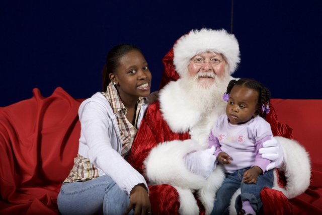 Santa Claus Spreads Joy to Mother and Child