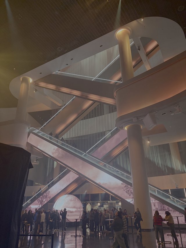 Futuristic Museum Interior with Crowd