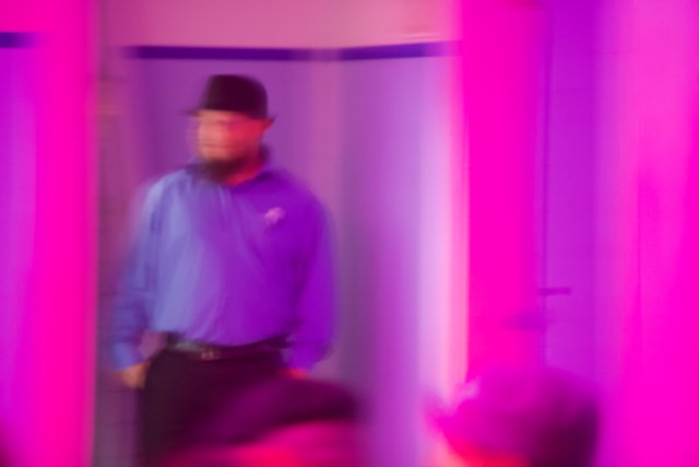 Man in Purple Room