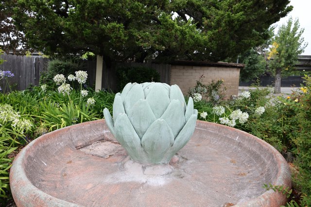 Artichoke Fountain Sculpture in Lush Garden Setting
