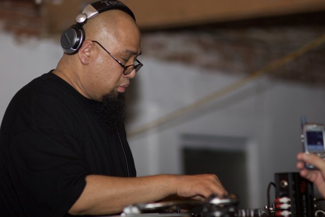 DJ Beats: The Musician with Headphones and Beard
