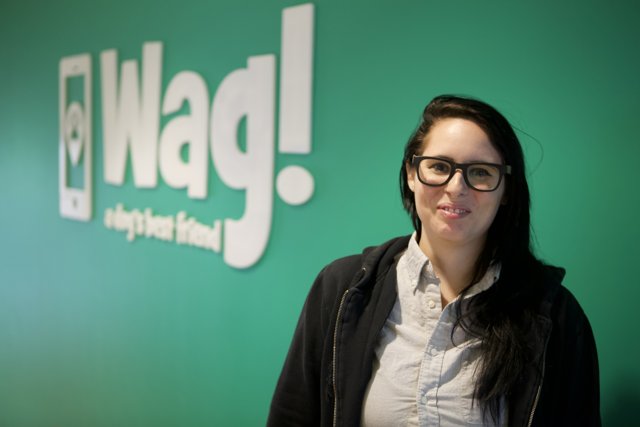 Stylish Woman Poses with Iconic Wag Logo