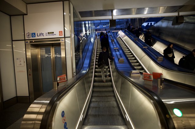 Modern Underground Transit Station with Blue Escalators