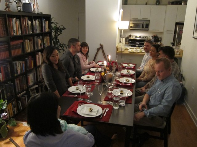 Intimate Hanukkah Dinner Party with Friends Around Table