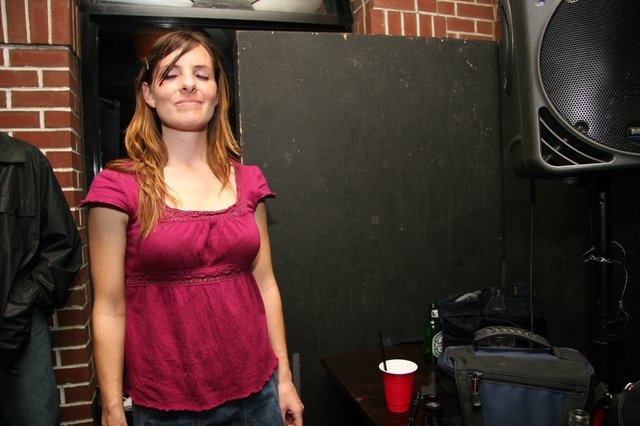 Woman with Eyes Closed at Live Music Venue