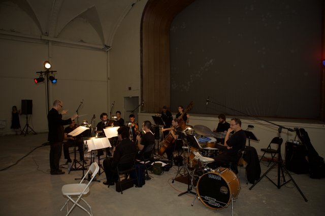 Group Performance of Musicians in a Large Room