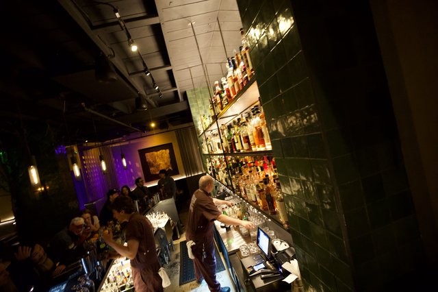 Upscale Bar Interior with Green Tile and Purple Ambiance
