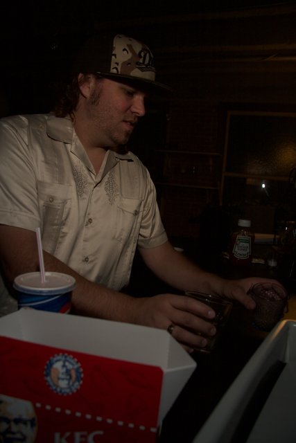 Colonel Sanders enjoying his drink