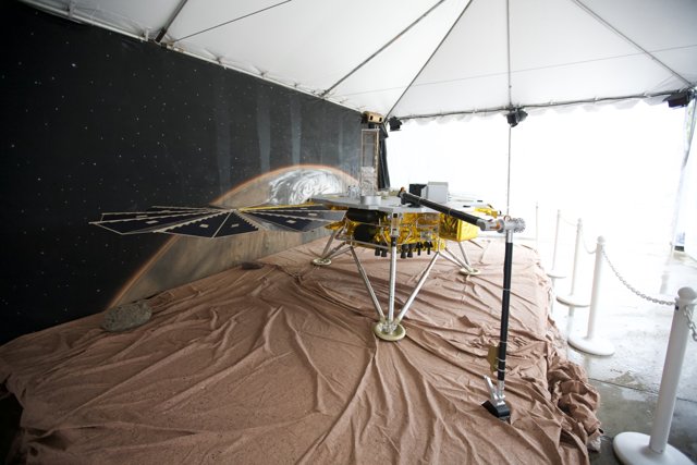 Model of Mars Rover on Display in Tent
