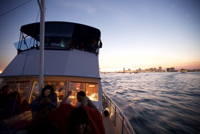 Boat ride at sunset with cityscape