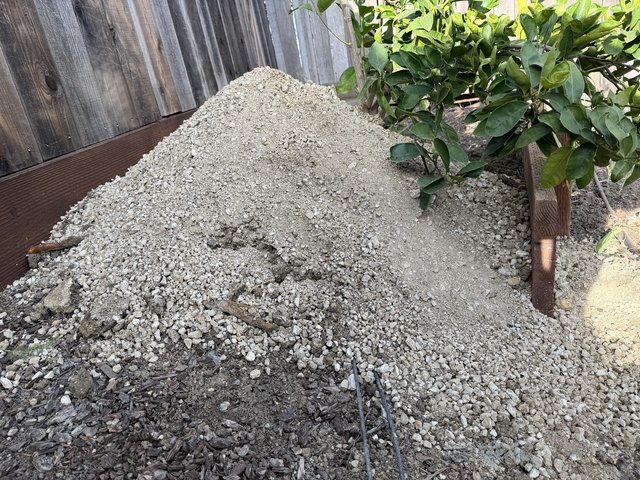 Fresh Gravel Pile in Residential Backyard Construction