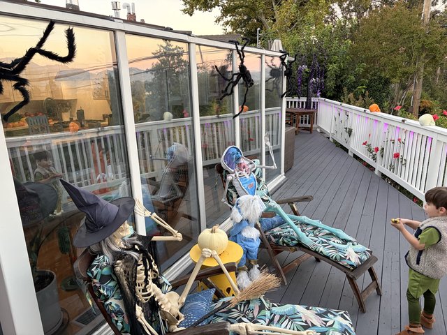 Halloween-Decorated Deck with Spooky Skeleton Display