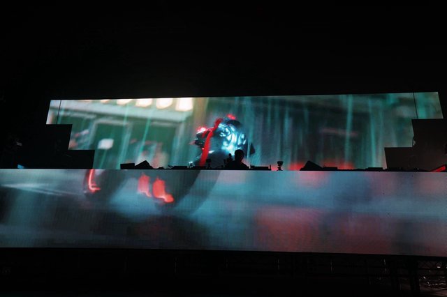DJ Silhouette Framed by Massive LED Stage Visuals