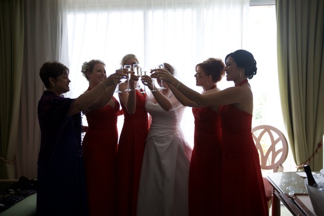 Toasting in Red Dresses
