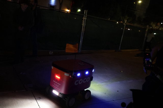 Coco Delivery Robot Navigates Urban Sidewalk at Night