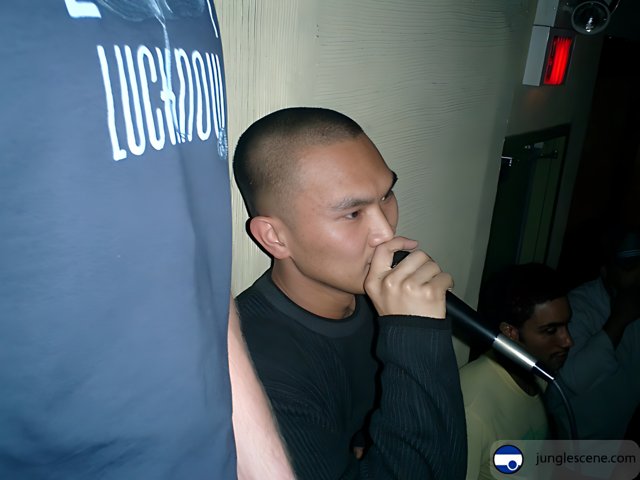 Qiu Shengjiong performing at the Karaoke Club