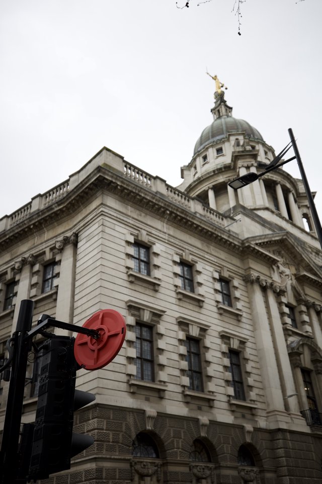Historic London Building with Golden Dome Under Overcast Sky