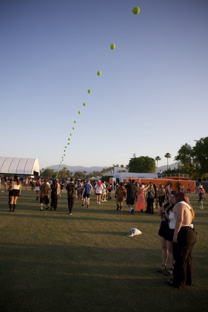 Sunset Soirée: A Cheerful Moment at Coachella 2024, Week 2