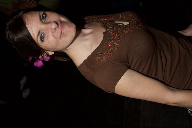 Smiling Woman with Pink Flower at Art Walk