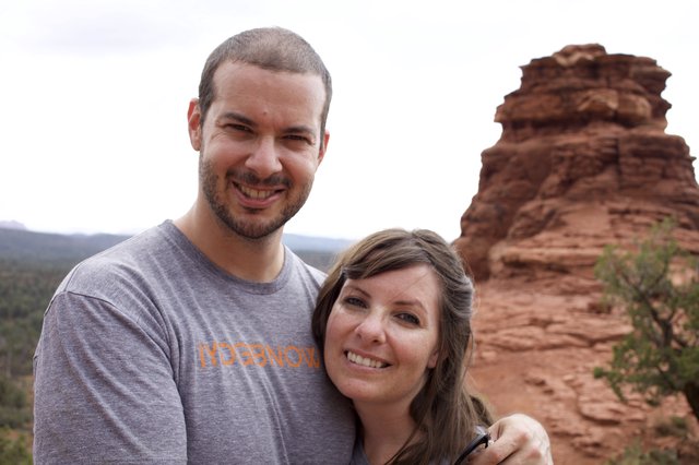 Couple Smiling Before Sedona Red Rock Formation