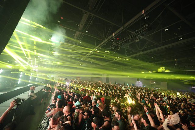 Massive Crowd Electrified by Green Laser Light Show