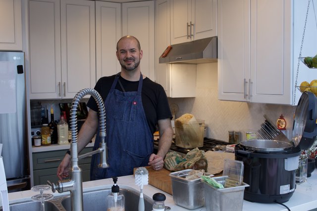 Home Chef Preparing Christmas Eve Dinner in Modern Kitchen
