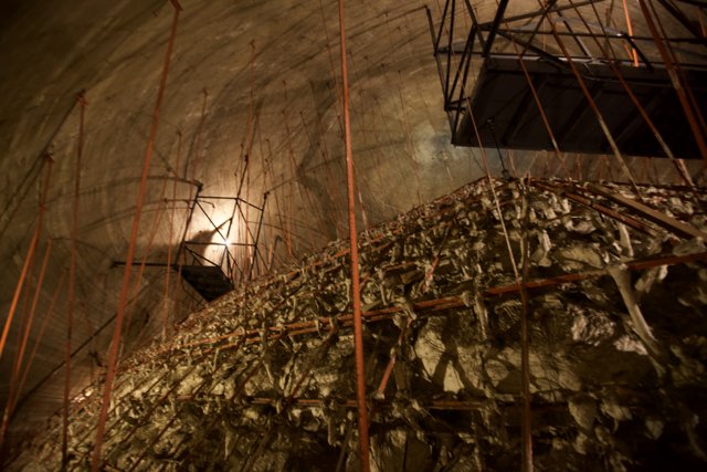 Scaffolding and Ladder in the Rubble-Covered Tunnel